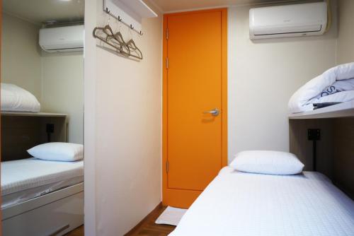 A bed or beds in a room at Star Hostel Seoul Dongdaemun