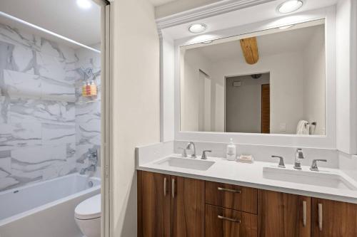 a bathroom with a sink and a mirror at 700 Monarch 201 in Aspen