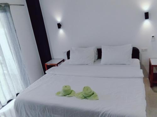 Postel nebo postele na pokoji v ubytování Jalyn's Resort Sabang