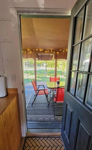 a door leading to a patio with a table and chairs at The Davis Loft in Davis