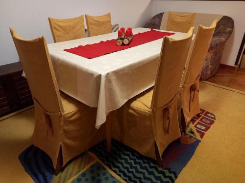 a table with a white table cloth on it at Kuća za odmor VB-IDRO in Tuhelj