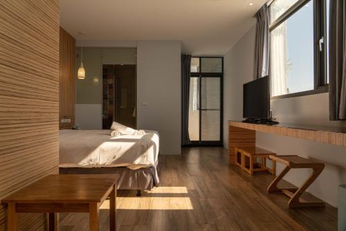 Una cama o camas en una habitación de HUA B&B