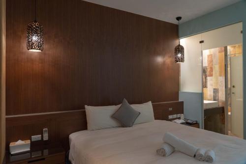 Una cama o camas en una habitación de HUA B&B
