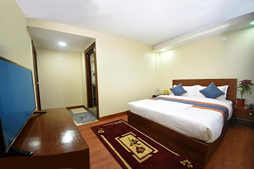 Cama o camas de una habitación en Karma Hotel Nepal