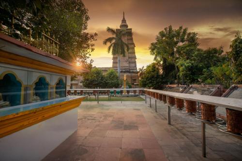 a view of a mosque with a tower in the background at Amritara Suryauday Haveli in Varanasi