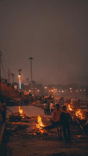 a group of people sitting on a bench at night at Amritara Suryauday Haveli in Varanasi