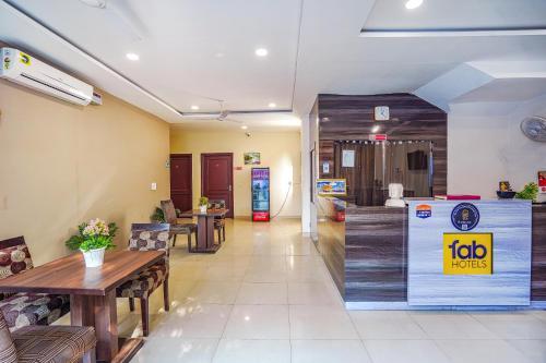 a living room with a table and a box at FabHotel Grand Inn in Jalandhar