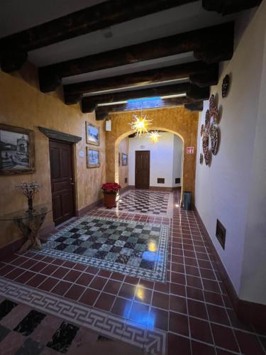 a large room with a tiled floor in a building at Mesón de las Delicias in Cuernavaca