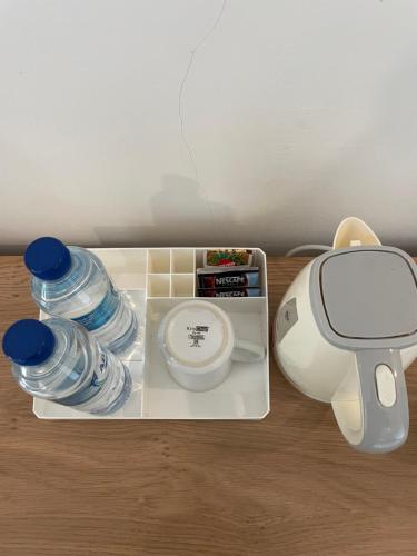 a tray with a blender and water bottles on a table at Red island villas in Banyuwangi