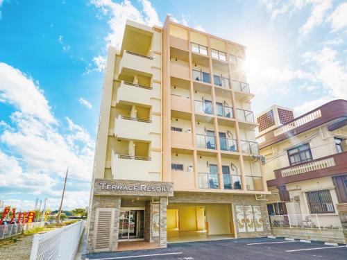 a building with a sign that reads heritage resort at Terrace Resort Mihama Chatan in Chatan