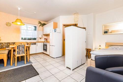 a kitchen and a living room with a bed and a table at Apartment in Bergisch Gladbach in Bergisch Gladbach