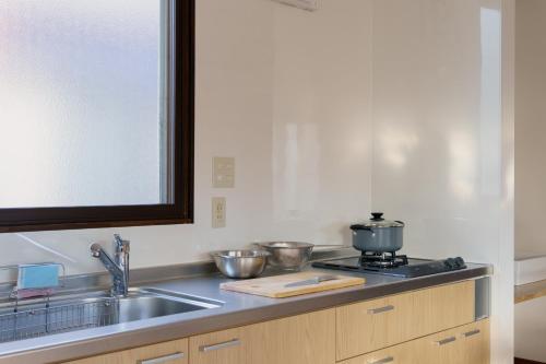 A kitchen or kitchenette at SOTO Myoko - close to Akakura Onsen Ski Lift and Town