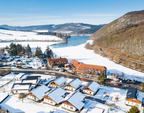 an aerial view of a town with snow covered roofs at Chaletpark Diemelsee in Heringhausen
