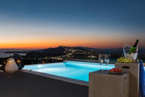 a pool on the roof of a building with a view at White & Co Exclusive Island Villas in Pirgos