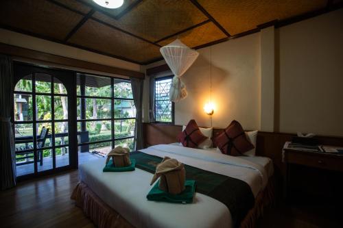 Ένα ή περισσότερα κρεβάτια σε δωμάτιο στο Southern Lanta Resort