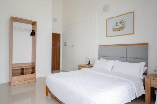 Una cama o camas en una habitación de True South