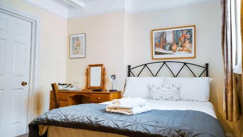Katil atau katil-katil dalam bilik di Pickwicks Guest House