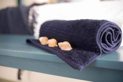 a black towel sitting on a blue table at True North West Coast in St Helena Bay