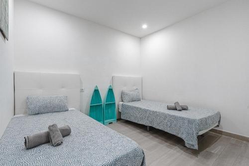 Posteľ alebo postele v izbe v ubytovaní APARTAMENTO DE LUJO EN MARE VERDE