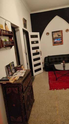 a living room with a couch and a table at Samad apartments in Essaouira