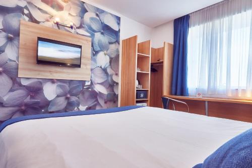 Postel nebo postele na pokoji v ubytování MyContinental Sibiu