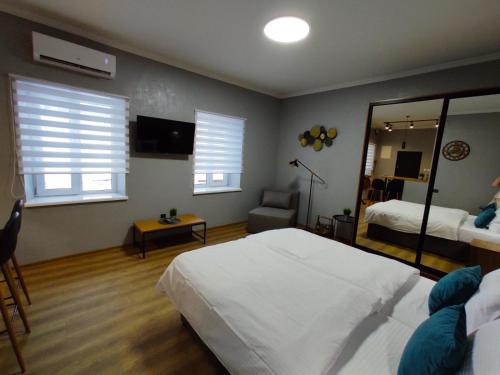 En eller flere senge i et værelse på Apart Club Tolstogo