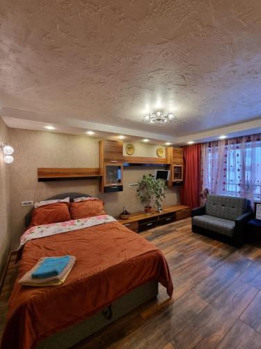 En eller flere senge i et værelse på Margo-Apartament