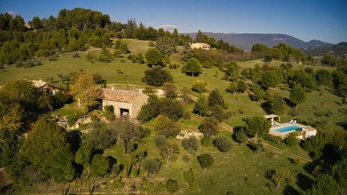 an aerial view of a house on a hill at Le Mas du Fort in Gargas