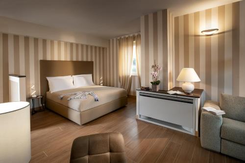 Katil atau katil-katil dalam bilik di Villa Cristina Suite
