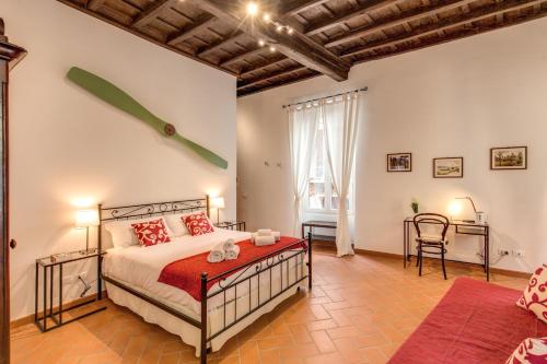 Ένα ή περισσότερα κρεβάτια σε δωμάτιο στο Piccolo Trevi Suites