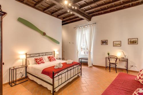 Postel nebo postele na pokoji v ubytování Piccolo Trevi Suites