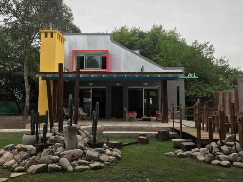 a building with a bunch of cacti in front of it at Apart Gallery - San Lorenzo - Salta in Salta