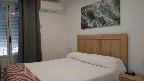 Cama o camas de una habitación en Hostal Castilla