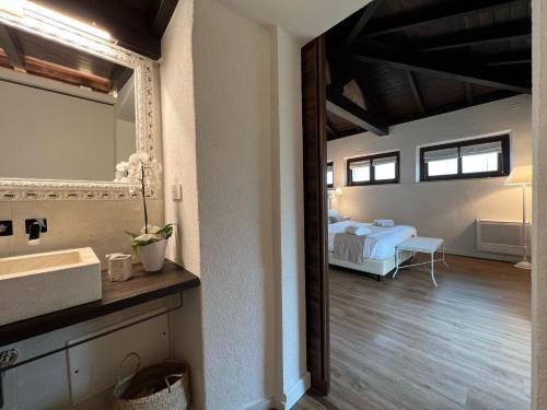 Postel nebo postele na pokoji v ubytování Corte Maddalena Camere