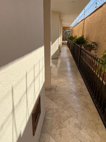 a hallway of a building with a tile floor at Mesón de las Delicias in Cuernavaca