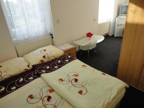 Postel nebo postele na pokoji v ubytování Hotel u Nádraží Lanžhot