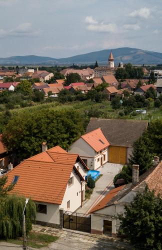 a view of a town with houses with orange roofs at Otto's Guesthouse in Prejmer
