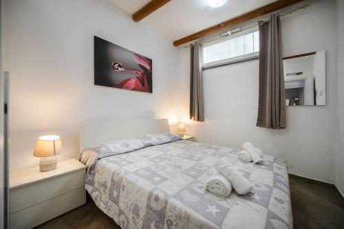 Posteľ alebo postele v izbe v ubytovaní Casa Vacanza M&C Ischia