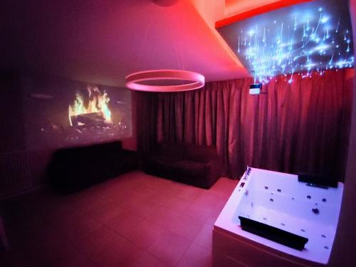 a dark room with a table and a frisbee in the air at Diamond Suite Verona in Verona