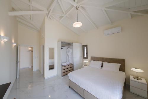 Posteľ alebo postele v izbe v ubytovaní Manazil Mani - Luxury Villas