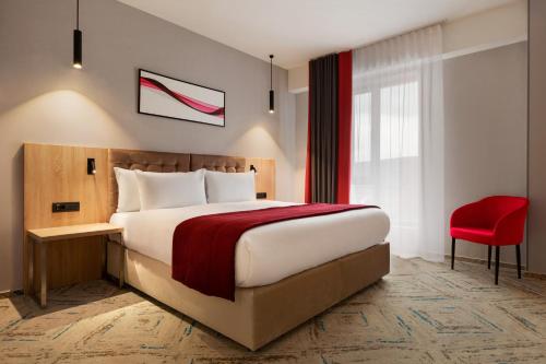 Postel nebo postele na pokoji v ubytování Ramada by Wyndham Targu Jiu