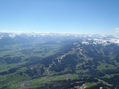 an aerial view of a valley with snow covered mountains at Ferienwohnung Grüntenpanorama im Jägerwinkl Allgäu in Rettenberg