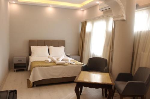 Voodi või voodid majutusasutuse Class Hotel toas