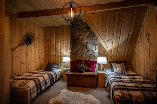 Un pat sau paturi într-o cameră la Wantula Mountain Shelter