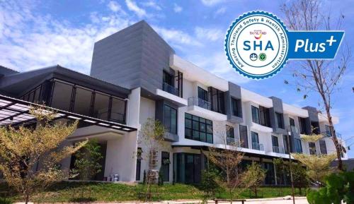 a rendering of a building with the shka plus logo at Hotel Chuan Chom The High Resort Saraburi - SHA Plus in Sara Buri