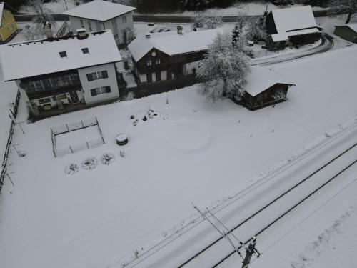 an aerial view of a snow covered yard with houses at Ferienwohnung Stricker in Obertraun