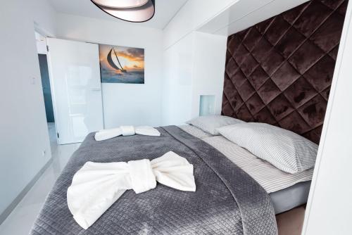 Postel nebo postele na pokoji v ubytování Fancy Sunset Gardenia Dziwnów