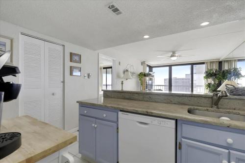 a kitchen with a counter and a sink and a window at Sea Watch VII in Ocean City