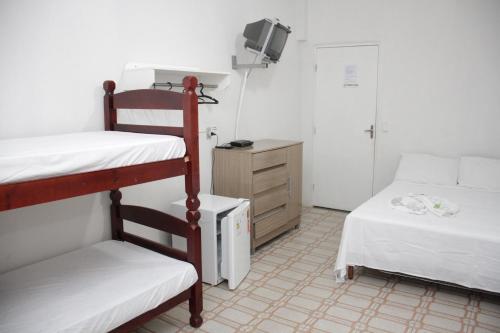 מיטה או מיטות קומותיים בחדר ב-Pousada Al Chaddai