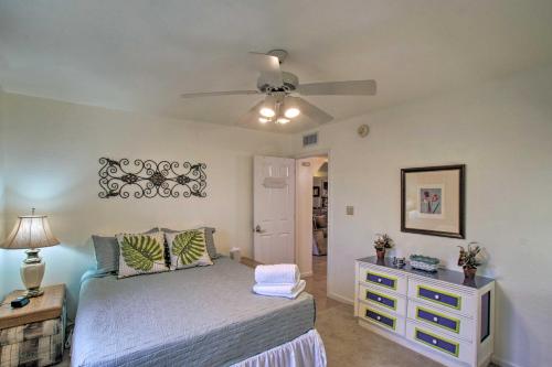 a bedroom with a bed and a ceiling fan at Phoenix Kick Back Corral with Outdoor Oasis! in Anthem